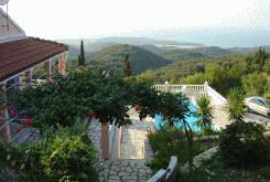 Magnificent views to the sandy beach of St. Spiridon Bay, two Greek islands and across the straits of Corfu to the mountains of Albania.